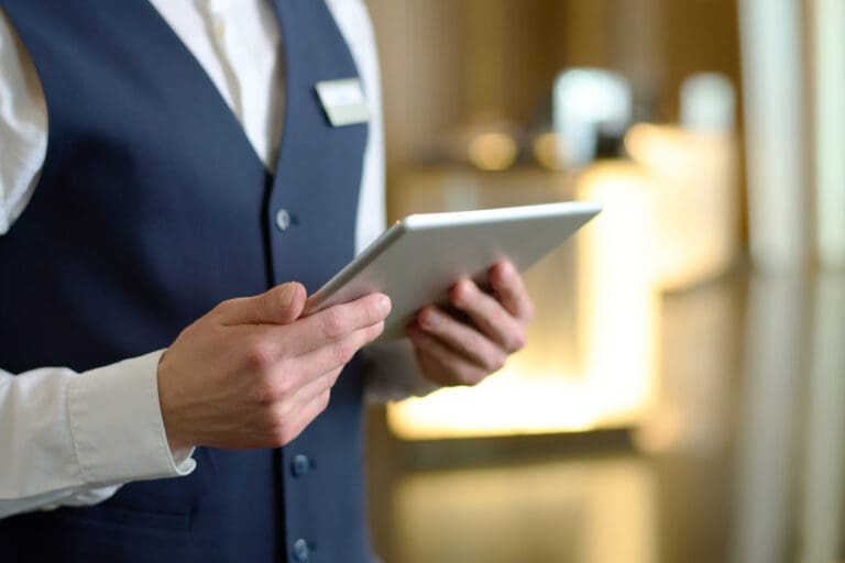 Playing to Win: Why Operational Discipline Matters in Gaming Hotel staff member using tablet to manage hospitality operations