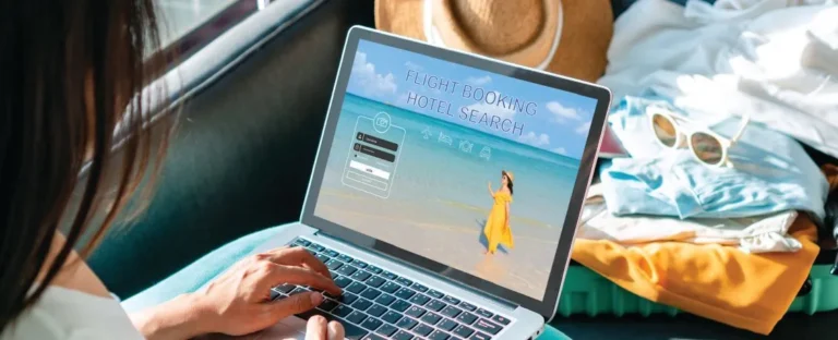 A guest browsing hotel booking options on a laptop, illustrating the digital touchpoints casino-hotels use to engage and retain loyal customers.